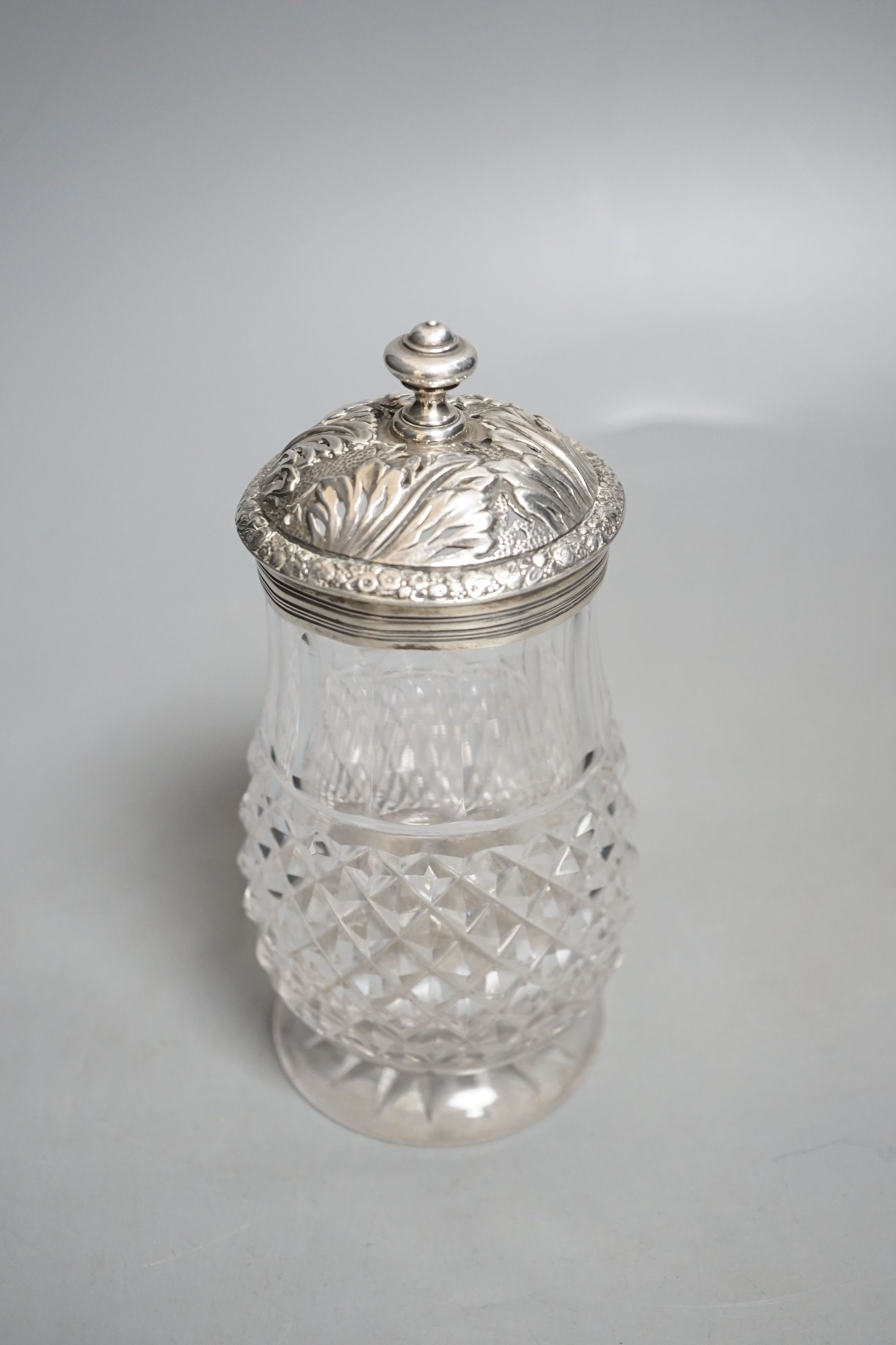 A late George III silver mounted cut glass caster, Edward Farrell, London, 1818, height 16.2cm (split).